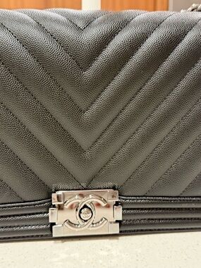 CHANEL Black Chevron Quilted Shoulder Bag with Silver CC Lock